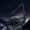 A black phone case is shown in a dramatic setting with rocks and dark background, suggesting durability. Náhled obrázku produktu