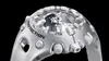 A close-up shot of a silver G-Shock watch against a black background. Produktbild-Vorschau