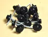 A pile of black-headed roofing nails on a light brown surface. Anteprima dell’immagine prodotto