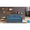 A blue sofa is displayed in a modern living room setting with shelves and a window view. Anteprima dell’immagine prodotto