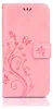 A pink phone case with a floral and butterfly design. Produktbild-Vorschau