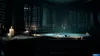 A dimly lit bathroom with candles surrounding a bathtub. Produktbild-Vorschau