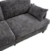 A close-up view of a dark gray chenille sofa. Produktbild-Vorschau