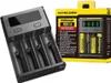 A Nitecore Intellicharger NEW i4 battery charger and its packaging are shown. The charger is black with multiple slots for batteries. The packaging is yellow and black and displays information about the charger and includes batteries. Produktbild-Vorschau