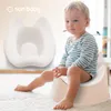 A toddler sits on a beige potty training seat, with a white potty training insert shown next to them. Produktbild-Vorschau