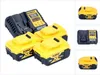 A DeWALT battery charger and three batteries are arranged on a white background. Náhled obrázku produktu