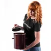 A woman holding a brown ceramic pot with a lid. Anteprima dell’immagine prodotto