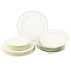 A set of white porcelain plates with a gold rim, stacked and arranged on a white background. Produktbild-Vorschau