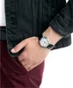 A close-up shot of a person's wrist wearing a watch. Podgląd zdjęcia produktu