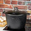A black speckled pot with a glass lid sits on a stovetop in front of a brick wall. Sliced mushrooms and whole mushrooms are on a wooden cutting board to the left. Voir les images du produit