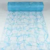 A roll of light blue decorative mesh fabric with a swirling pattern, partially unrolled on a white surface. Produktbild-Vorschau