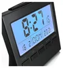A close-up, angled shot of a black digital alarm clock with a blue illuminated display. Produktbild-Vorschau