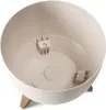 A close-up, angled view of an empty, beige, speckled planter bowl with three wooden legs. Produktbild-Vorschau