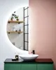 A modern bathroom vanity with a round LED mirror, a vessel sink, and a black faucet. Produktbild-Vorschau