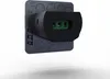 A close-up, angled view of a small electronic device with a black connector and a gray base plate, set against a light gray background. Anteprima dell’immagine prodotto