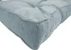 A close-up view of the corner of a blue cushion. Produktbild-Vorschau