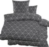 A stack of folded bedding with a geometric triangle pattern.