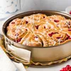 A close-up shot of a baked dessert in a round springform pan. Produktbild-Vorschau