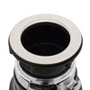 Close-up view of the top part of a garbage disposal unit, focusing on the sink flange and the opening. Voir les images du produit