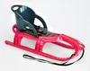 A pink and gray children's sled with safety straps, shown against a white background. Anteprima dell’immagine prodotto