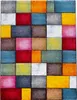 A close-up, top-down view of a colorful, geometric rug. Produktbild-Vorschau