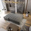 A modern living room with a large sectional sofa, coffee table, and decorative elements. Produktbild-Vorschau