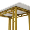 A close-up view of the underside of a modern dining table with a marble-patterned top and gold metal legs. Podgląd zdjęcia produktu