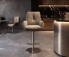 A modern kitchen or dining area with a bar stool, chairs, and a counter. Produktbild-Vorschau