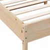 A close-up view of the corner of a wooden bed frame, showing the slatted base and the joinery. Produktbild-Vorschau
