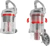 Two images of a vacuum cleaner dustbin showing how to empty it. Produktbild-Vorschau