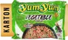 A package of Yum Yum instant vegetable noodle soup is shown against a white background, with a cardboard box labeled 'KARTON' to the left. Produktbild-Vorschau
