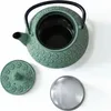 A green cast iron teapot with a lid and a tea strainer, displayed on a white background. Podgląd zdjęcia produktu