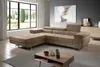 A modern living room with a sectional sofa, coffee table, and large window. Produktbild-Vorschau