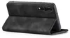 A black flip case for a smartphone is shown from the back, with the case open. Produktbild-Vorschau