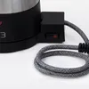 Close-up of the base of a coffee maker, showing the power switch and the power cord. Náhľad obrázku produktu