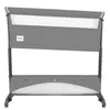 A gray baby crib with white mesh sides, shown from the front. Anteprima dell’immagine prodotto