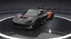 A racing car is displayed on a rotating platform in a studio setting. Produktbild-Vorschau