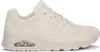 A side view of a single beige SKECHERS UNO sneaker. Voir les images du produit