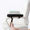 A hand adjusting a black armrest cushion on a white office chair. Produktbild-Vorschau