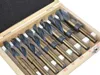 A set of drill bits in a wooden case. Voir les images du produit
