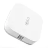 A white smart home sensor with a thermometer icon on top. Voir les images du produit