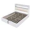 A white bed frame with a slatted base and a headboard with shelves. Anteprima dell’immagine prodotto
