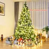 A decorated Christmas tree in a room with gifts underneath. Voir les images du produit