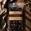 Gaia Kallisti Kalamata-Oliven Packung auf edler Seide und Holz Produktbild-Vorschau