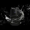A black Bluetooth speaker is shown with water splashing around it against a black background. Voir les images du produit