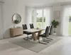 A dining room scene with a table and chairs set up. Produktbild-Vorschau