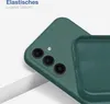 A close-up shot of a green phone case, showing the camera cutout and the interior texture. The case is partially covering a phone with a similar green color. Produktbild-Vorschau