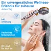 A woman is taking a shower with a handheld showerhead. Produktbild-Vorschau