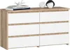 A chest of drawers with six drawers, decorated with two small decorative objects and a stack of books on top. Produktbild-Vorschau