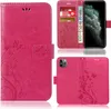 A collage of images showing a pink phone case with a floral and butterfly design, including a view of the case open with cards and cash, and a view of the back of the case with a phone inserted. Produktbild-Vorschau